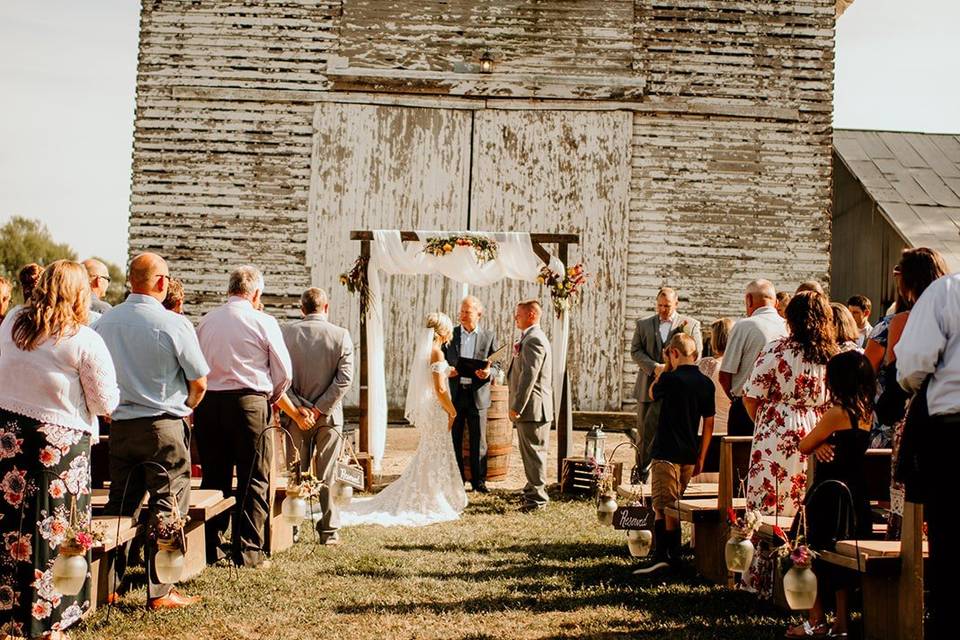 A rustic outdoor ceremony