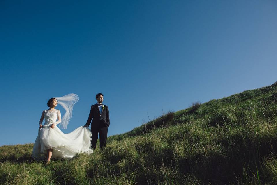 Bride and groom with a little