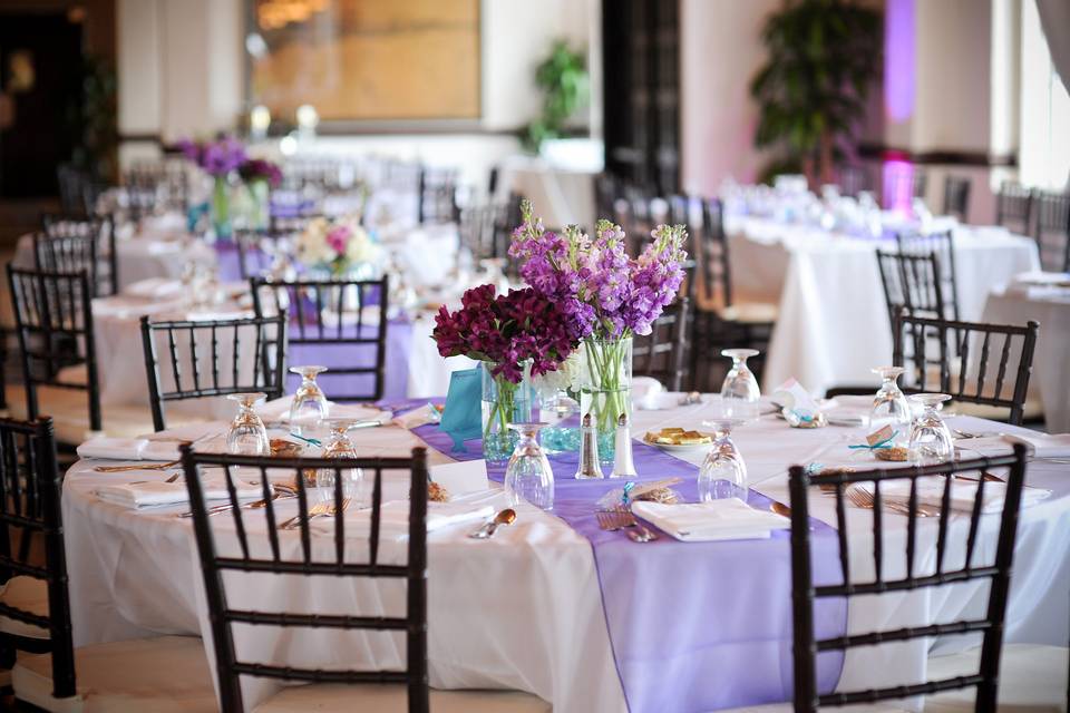 Round table setup with lavender centerpiece