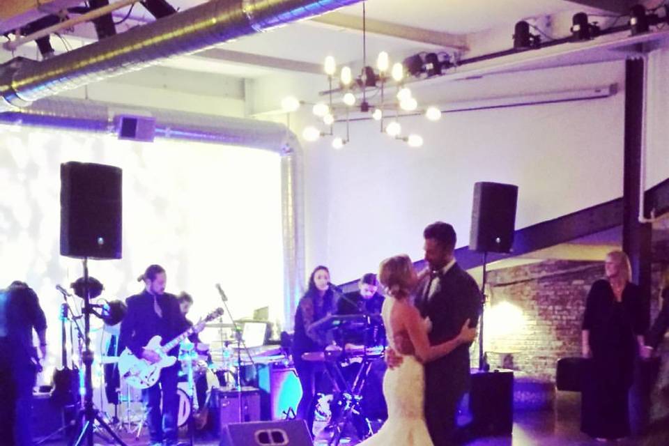 Newlyweds dance to the band's music