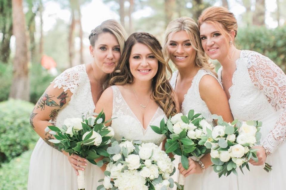 Holding white bouquets