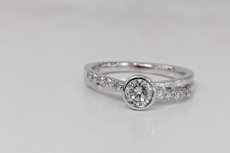 Bezel set diamond ring.