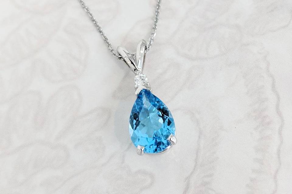 Blue topaz and diamond pendant