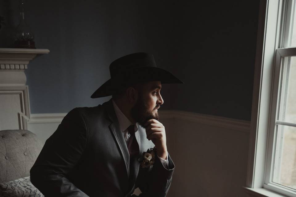 Dramatically lit groom solo