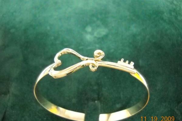 Key to Her Heart Bracelet.  Companion piece to the Key to Her Heart Pendant. Exclusively at Quinn's Goldsmith.  Custom designed and signed by Terry Quinn.