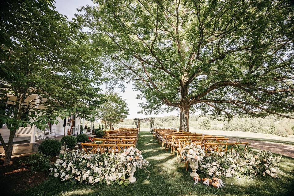 Oak tree ceremony by farmhouse