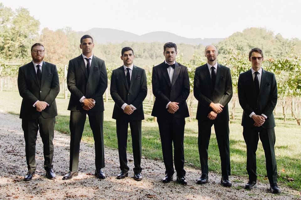 Groomsmen portraits near cabin
