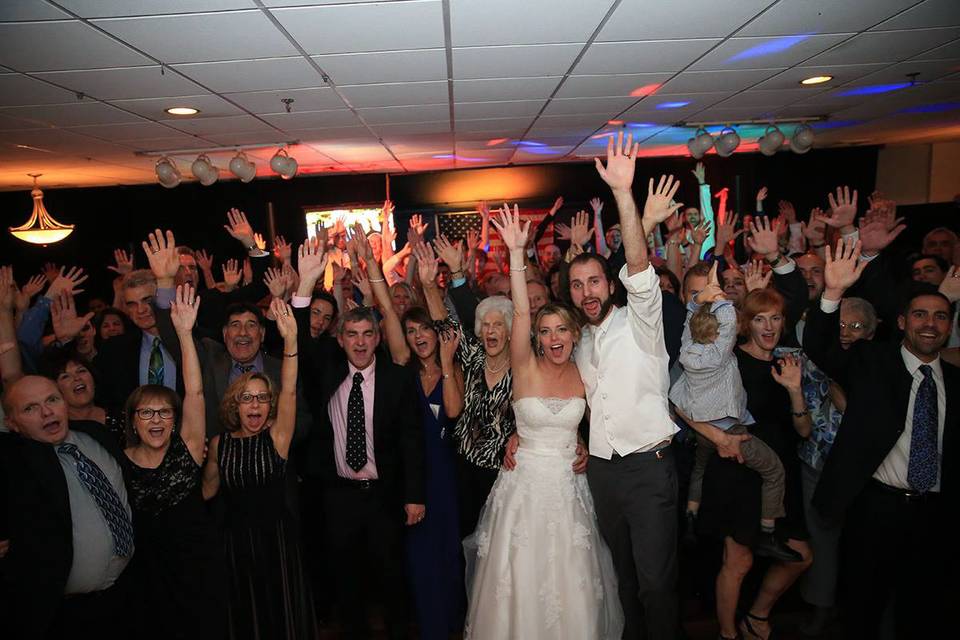 The couple with the bridesmaids and groomsmen