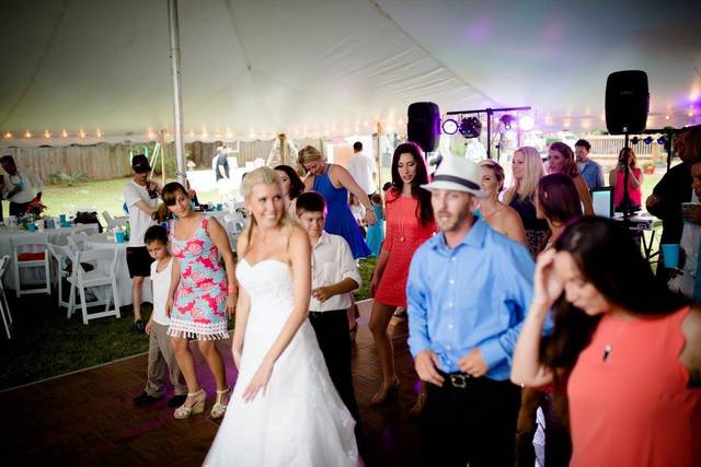 The couple dancing with guests