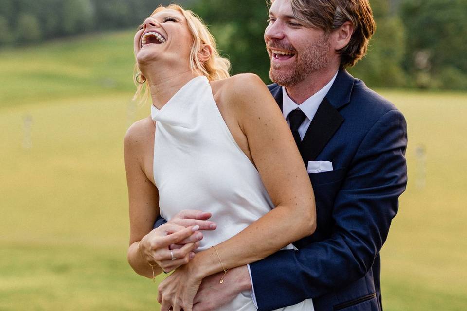 Bride and groom laughing