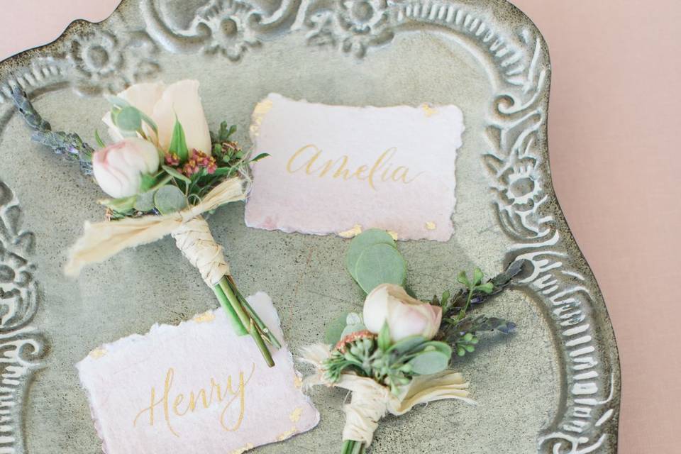 Hand painted ombre blush pink and gold calligraphy place cards.