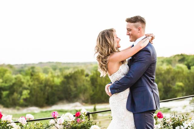 Happy couple posing on balcony
