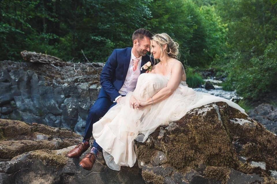 Couple posing on rocks