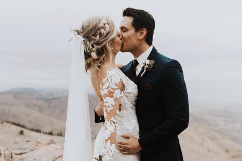 Groom kissing his bride