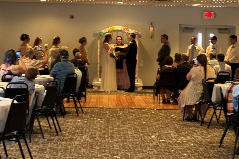 Indoor wedding w white arch