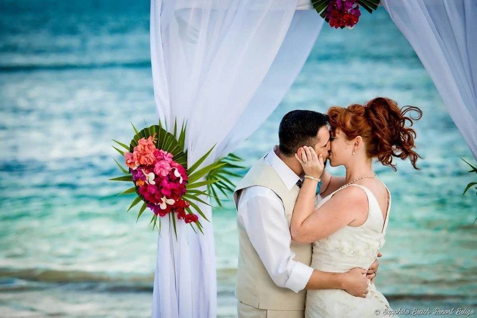 Beach wedding kiss