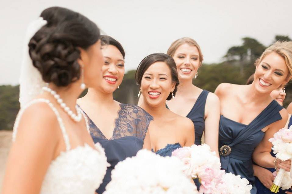 All smiles from the bridesmaids for the bride