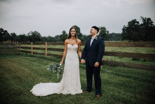 Couple posing in a field