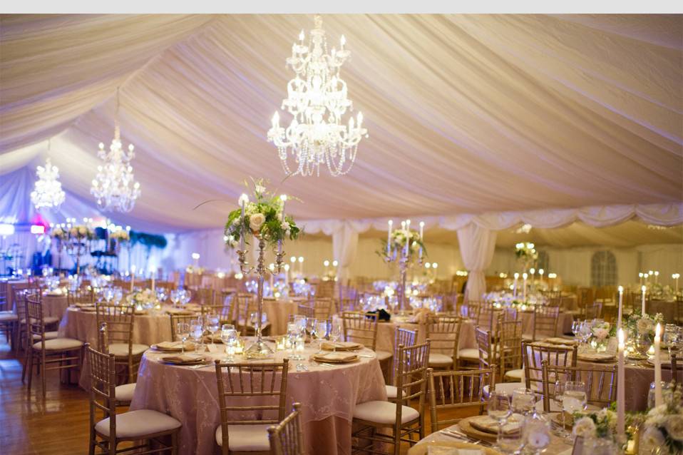 Reception tent chandeliers over the tables