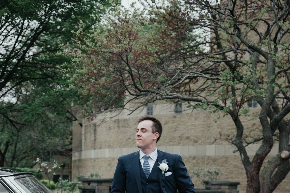 Groom with vintage car