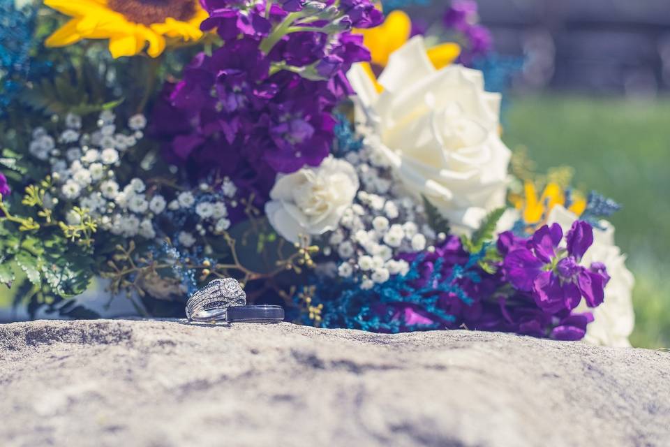 Closeup of rings and bouquet