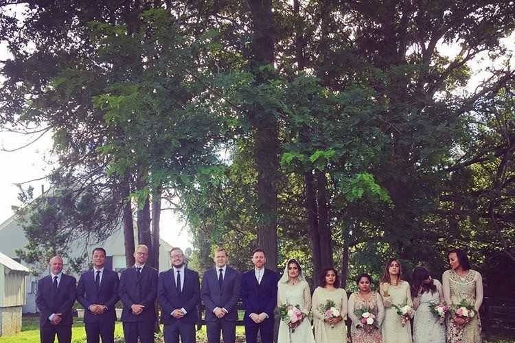 Newlyweds, bridesmaids, and groomsmen