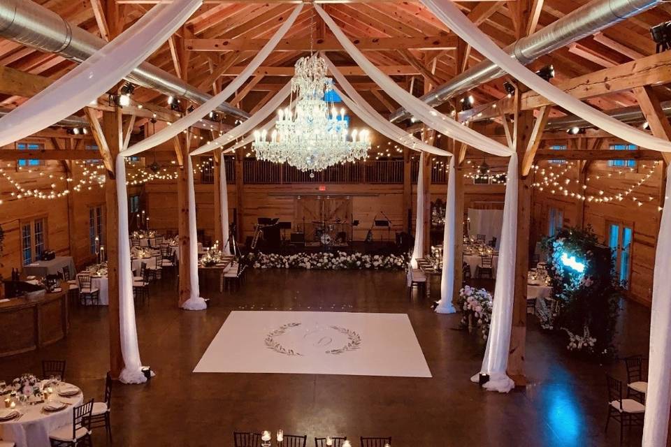 Newlyweds kissing in the barn