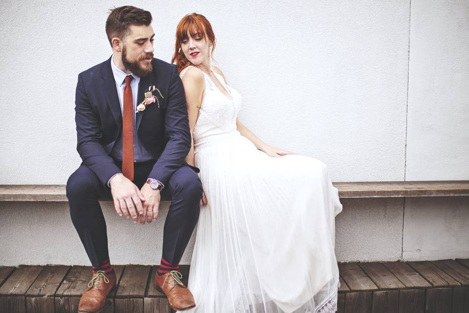 Bride leaning on her groom