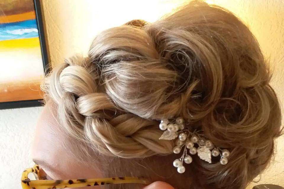 Side swept hair curls with silver hair ornament