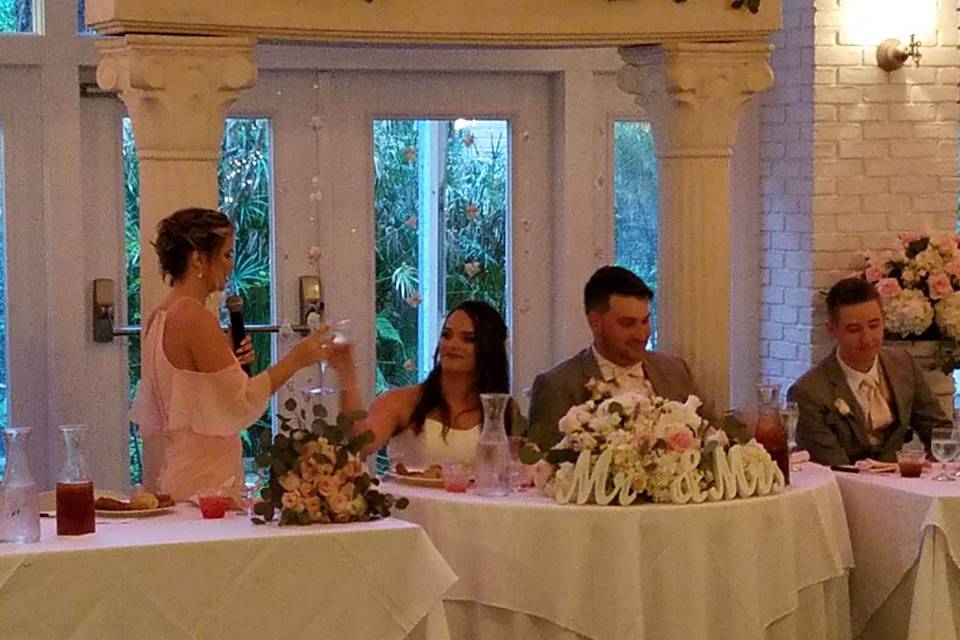 Proposing a toast for the newlyweds