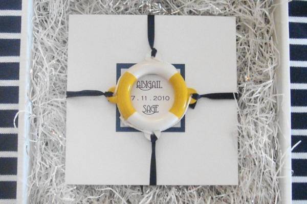 Nautical Wedding Invitation that is sea inspired and comes with a life ring embellishment.