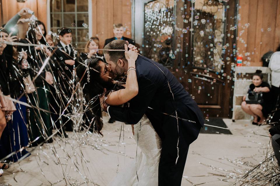 Groom kissing his bride