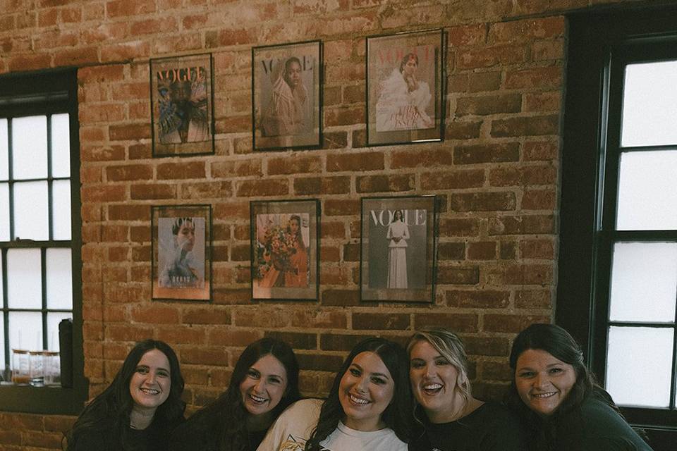 Bride and bridesmaids in suite