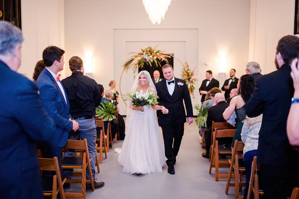 NYE couple walking down aisle