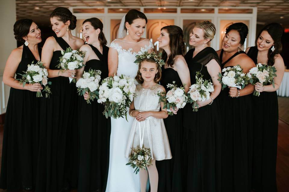 The bride with her bridesmaids and flower girl