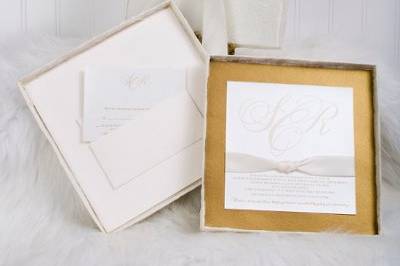 Custom designed multi-layer wedding invitation inside a textured silk covered box. Inner pocket was built to contain the reception and rsvp set and complimented the look of the suite.