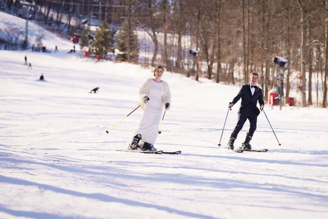 Bride and groom skiing