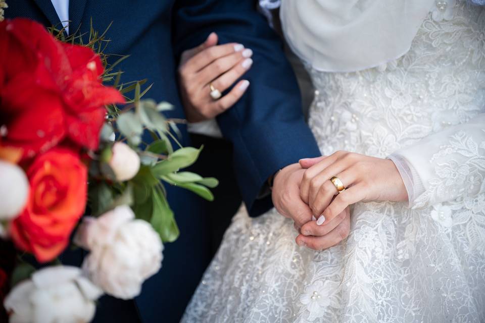 Bride and groom holding hands