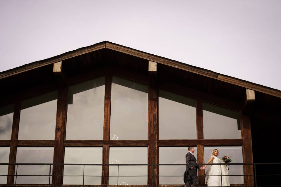 Couple in front of windows