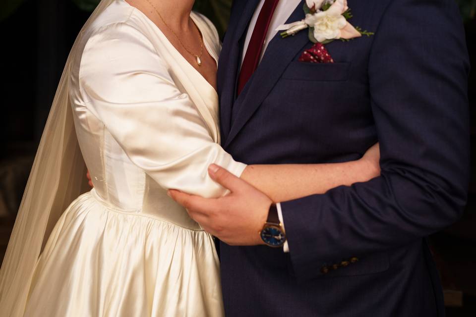 Groom kissing forehead