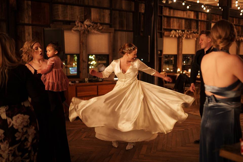 Bride twirling on dance floor