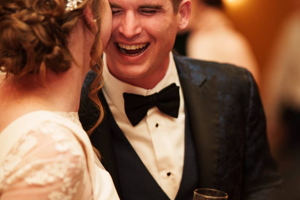 Groom laughing