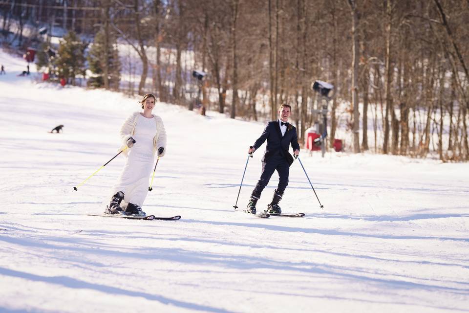 Bride and groom skiing