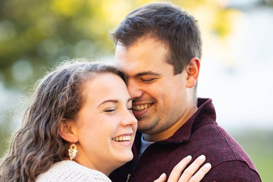 Engaged couple laughing