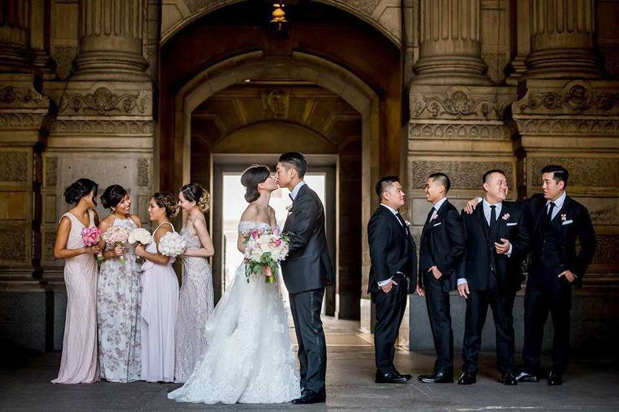 The couple with the bridesmaids and groomsmen