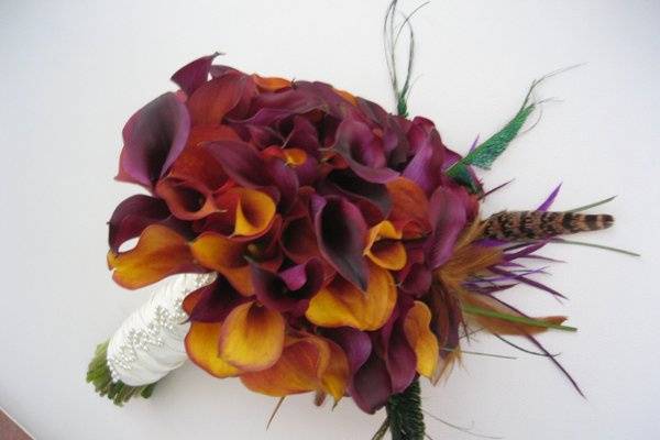this bouquet was made for a Moroccan themed wedding. Just beautiful with the touch of feathers..