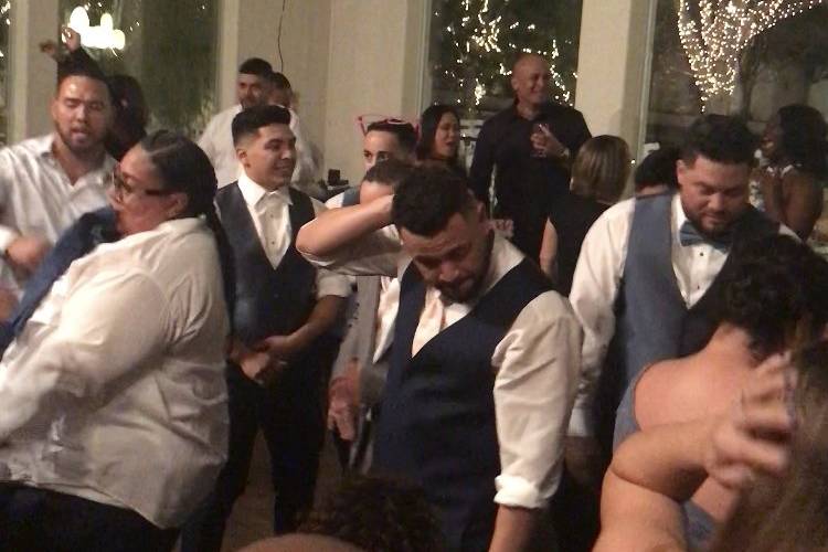 Groom and guests on the dance floor