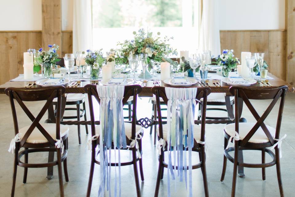 The drapes add a feminine touch to such a handsome interior.  Doesn't our farm table look great dressed up?