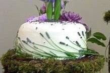 My first tier of carrot cake with white chocolate cream cheese frosting. Adorned with lavender and iris.