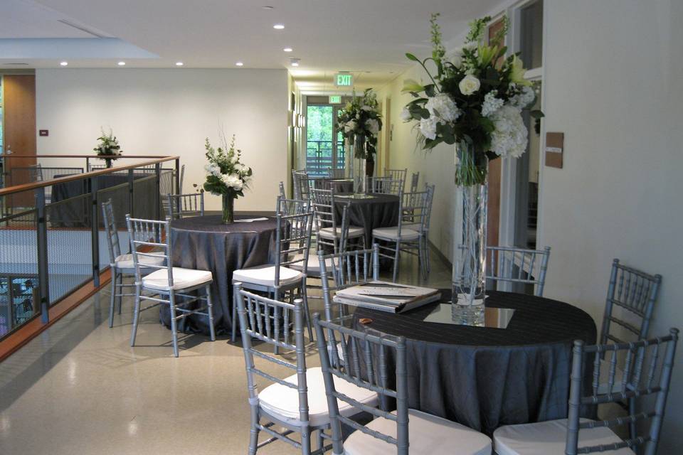 For dramatic effect, this event chose a combination of high and low centerpieces to break up the venue space.